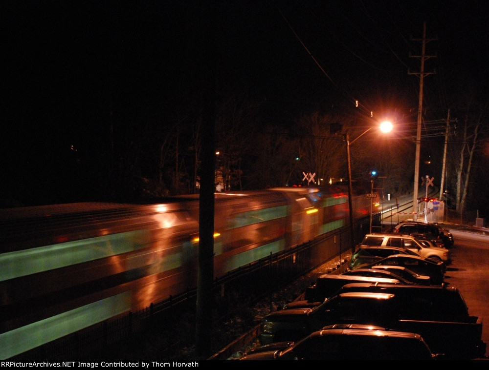 NJT's 5737 is gradually slowing for a station stop at 6 o'clock